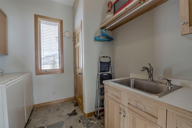 1235 Elk Run Rd, Silverthorne, CO 80498 - laundry room featuring cabinet space, independent washer and dryer, plenty of natural light, and baseboards
