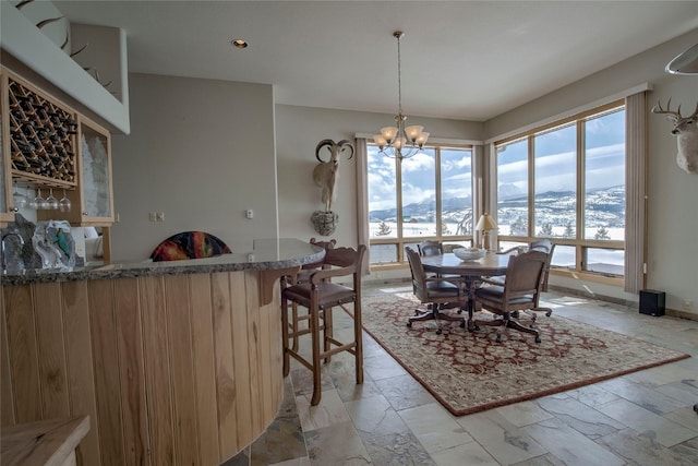 1235 Elk Run Rd, Silverthorne, CO 80498 - dining room with a chandelier, bar, and a mountain view