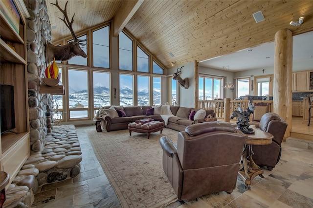 1235 Elk Run Rd, Silverthorne, CO 80498 - living area featuring high vaulted ceiling, stone tile floors, a mountain view, and beamed ceiling