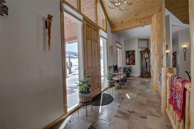 1235 Elk Run Rd, Silverthorne, CO 80498 - entryway featuring lofted ceiling, a chandelier, and wood ceiling