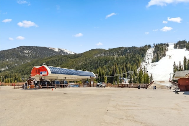 23110 US Highway 6 Unit 5054, Keystone, CO 80435 - view of parking featuring a mountain view and a view of trees