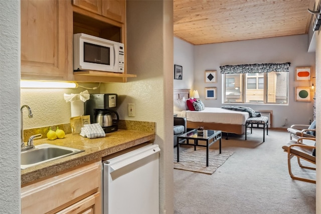 23110 US Highway 6 Unit 5054, Keystone, CO 80435 - bedroom featuring a sink, light colored carpet, a textured wall, and wooden ceiling