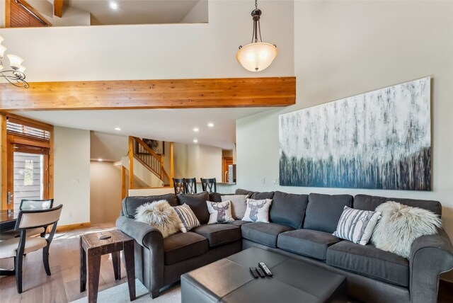 24 Rasor Dr Unit 24, Keystone, CO 80435 - living area featuring recessed lighting, light wood-type flooring, stairs, and beam ceiling