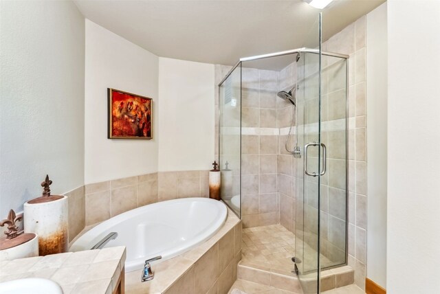 24 Rasor Dr Unit 24, Keystone, CO 80435 - bathroom featuring a garden tub, vanity, and a shower stall