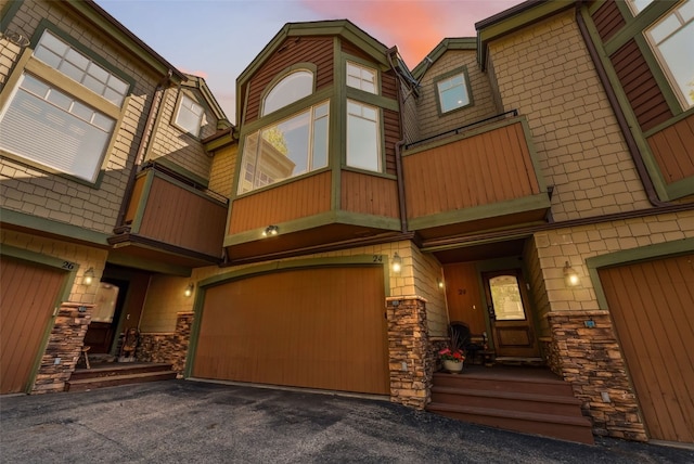 24 Rasor Dr Unit 24, Keystone, CO 80435 - view of building exterior with a garage and asphalt driveway