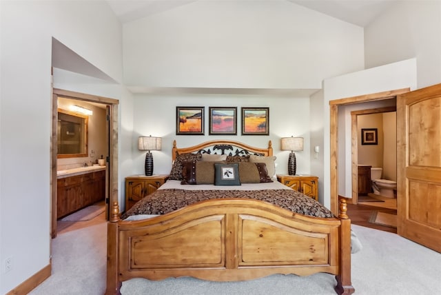 24 Rasor Dr Unit 24, Keystone, CO 80435 - bedroom featuring high vaulted ceiling, carpet, and ensuite bath