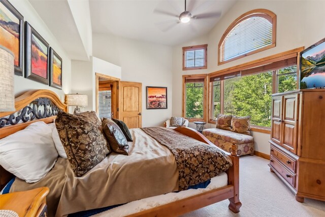 24 Rasor Dr Unit 24, Keystone, CO 80435 - bedroom featuring light colored carpet, high vaulted ceiling, and a ceiling fan