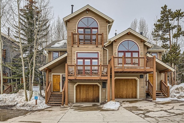 422 Kings Crown Rd Unit 5, Breckenridge, CO 80424 - view of front facade with a garage, driveway, a balcony, and roof with shingles