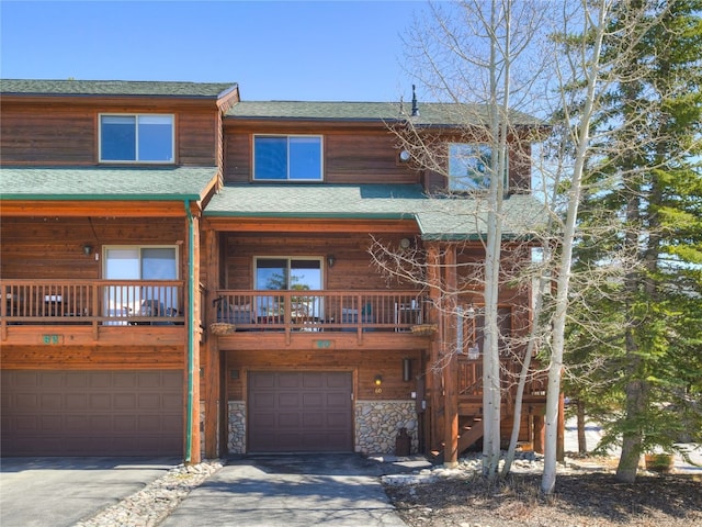 60 Lookout Ridge Dr, Dillon, CO 80435 - view of front of property featuring an attached garage, driveway, and a shingled roof
