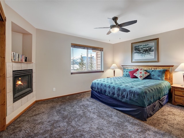 60 Lookout Ridge Dr, Dillon, CO 80435 - carpeted bedroom featuring baseboards, ceiling fan, and a fireplace