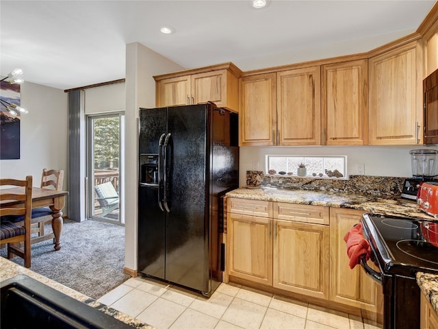 60 Lookout Ridge Dr, Dillon, CO 80435 - kitchen featuring light brown cabinets, stone countertops, recessed lighting, light colored carpet, and black appliances