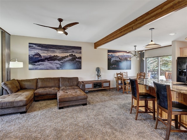 60 Lookout Ridge Dr, Dillon, CO 80435 - carpeted living room featuring beamed ceiling, baseboards, and ceiling fan with notable chandelier
