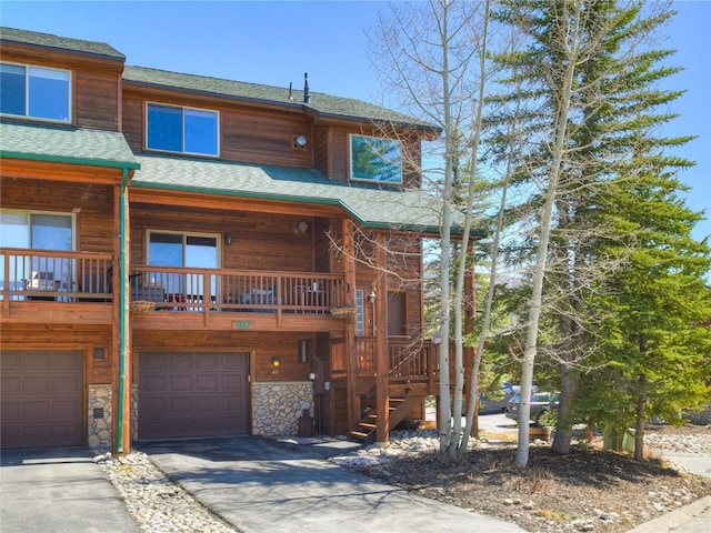 60 Lookout Ridge Dr, Dillon, CO 80435 - view of front of house featuring aphalt driveway, stairs, roof with shingles, and a garage