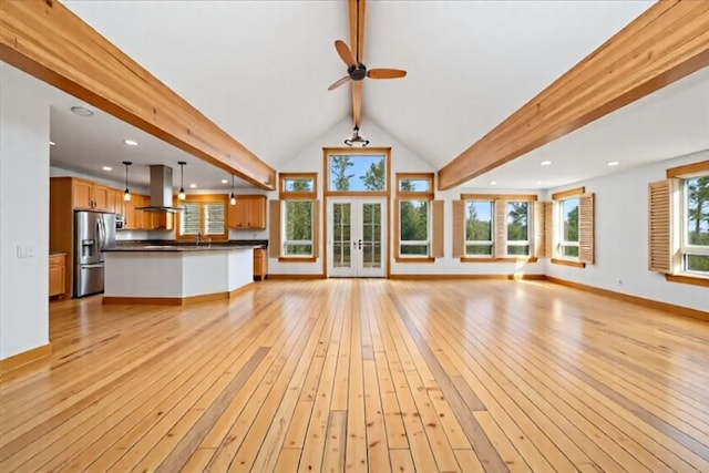 121 Shekel Ln, Breckenridge, CO 80424 - unfurnished living room with light wood finished floors, french doors, a ceiling fan, and recessed lighting