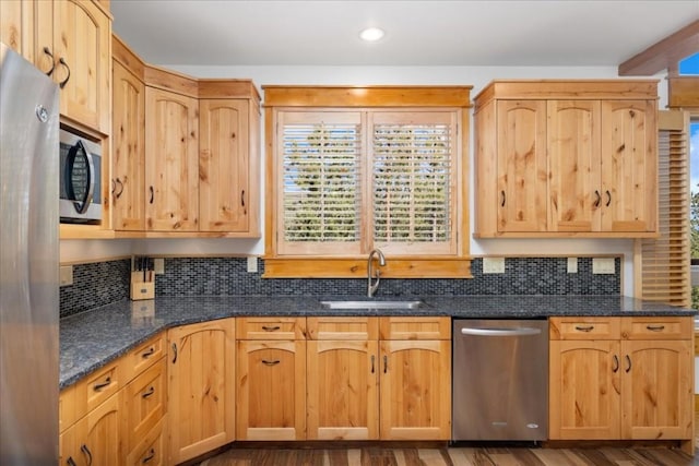 121 Shekel Ln, Breckenridge, CO 80424 - kitchen featuring appliances with stainless steel finishes, decorative backsplash, dark stone countertops, recessed lighting, and dark wood-type flooring
