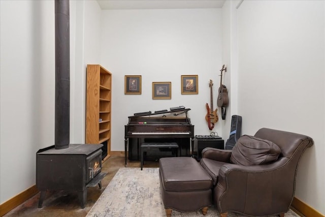 121 Shekel Ln, Breckenridge, CO 80424 - living area featuring a wood stove and baseboards