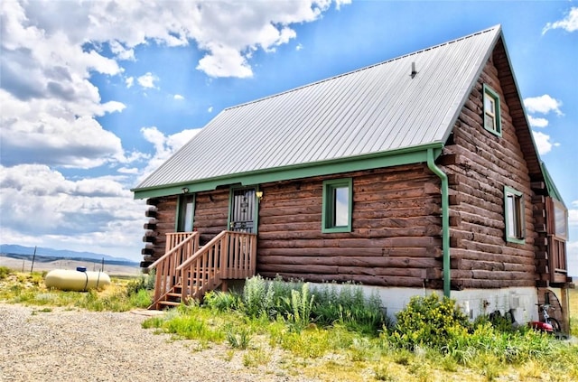 262 Swandyke Ct, Jefferson, CO 80456 - cabin featuring log exterior and a metal roof