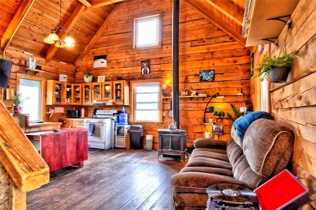 262 Swandyke Ct, Jefferson, CO 80456 - living room with a wood stove, dark wood finished floors, wood walls, a wooden ceiling with exposed beams, and high vaulted ceiling