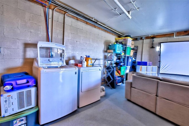 262 Swandyke Ct, Jefferson, CO 80456 - basement with washing machine and clothes dryer, concrete block wall, and a garage