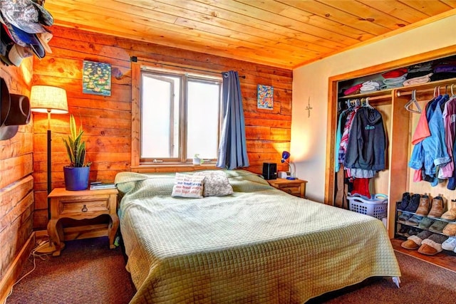262 Swandyke Ct, Jefferson, CO 80456 - bedroom with wooden ceiling, a closet, carpet floors, and wood walls