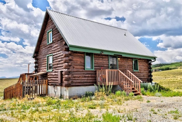 262 Swandyke Ct, Jefferson, CO 80456 - log home with log siding and a metal roof