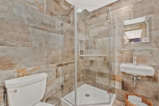 2650 Medicine Springs Dr Unit 11, Steamboat Springs, CO 80487 - full bathroom featuring tile walls, a shower stall, a sink, and toilet