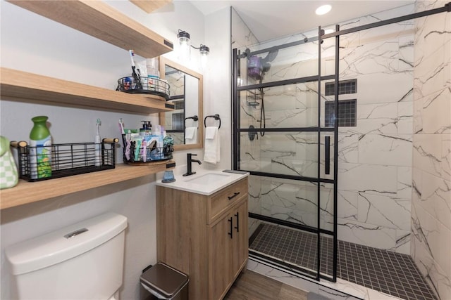 22714 US Highway 6 Unit 5958, Keystone, CO 80435 - bathroom featuring toilet, vanity, a marble finish shower, wood finished floors, and recessed lighting