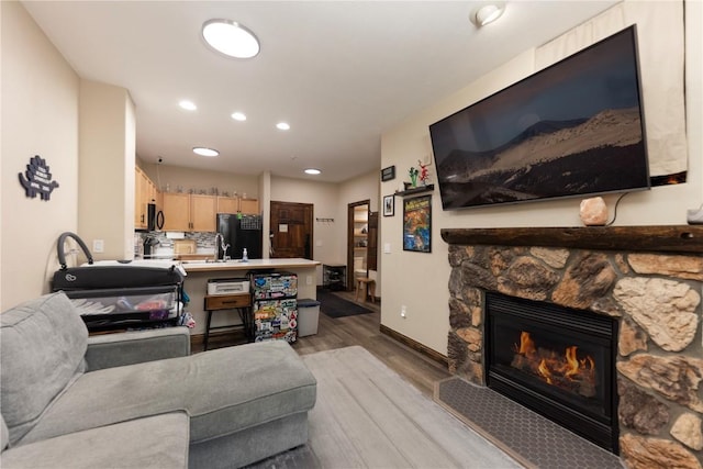 22714 US Highway 6 Unit 5958, Keystone, CO 80435 - living room featuring light wood-style flooring, recessed lighting, a fireplace, and baseboards