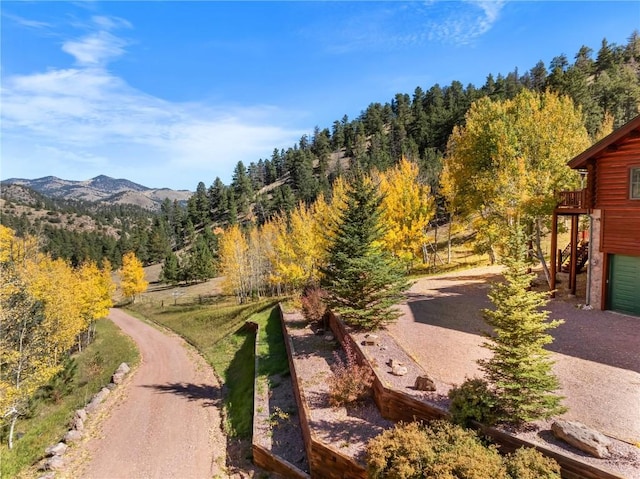 exterior space with a view of trees and a mountain view