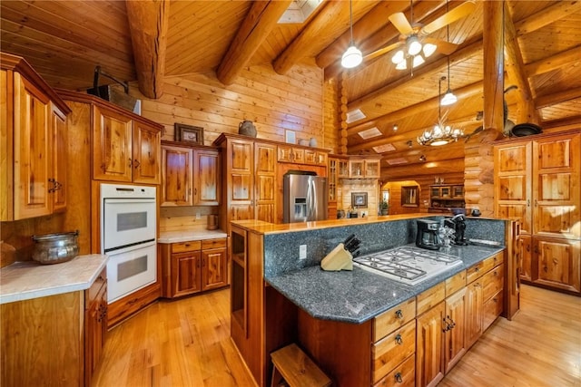 kitchen with beamed ceiling, light wood-style floors, wood ceiling, and white appliances