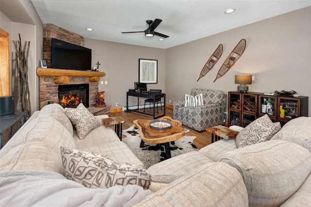 164 Buck Ridge Rd Unit 164, Summit Cove, CO 80435 - living area with wood finished floors, a stone fireplace, a ceiling fan, and recessed lighting