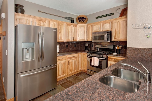 164 Buck Ridge Rd Unit 164, Summit Cove, CO 80435 - kitchen featuring appliances with stainless steel finishes, light brown cabinets, backsplash, and dark stone counters