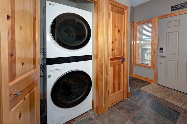 164 Buck Ridge Rd Unit 164, Summit Cove, CO 80435 - laundry room with stacked washing machine and dryer and dark stone finish floors