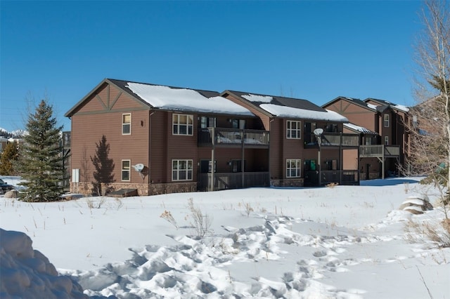 164 Buck Ridge Rd Unit 164, Summit Cove, CO 80435 - snow covered property featuring stone siding