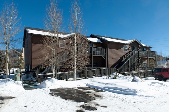 164 Buck Ridge Rd Unit 164, Summit Cove, CO 80435 - snow covered house featuring stairway
