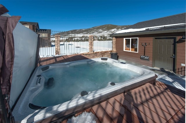 164 Buck Ridge Rd Unit 164, Summit Cove, CO 80435 - snow covered deck with a hot tub and a mountain view