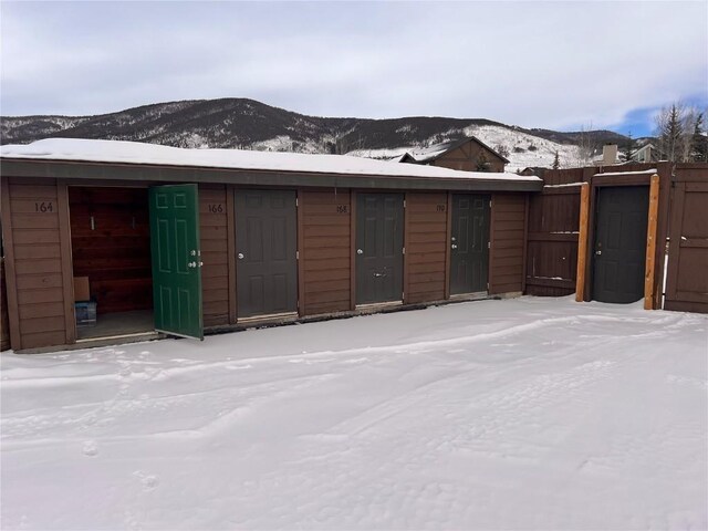164 Buck Ridge Rd Unit 164, Summit Cove, CO 80435 - snow covered garage with a mountain view