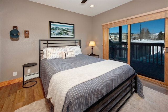 164 Buck Ridge Rd Unit 164, Summit Cove, CO 80435 - bedroom featuring access to outside, a baseboard heating unit, wood finished floors, and recessed lighting