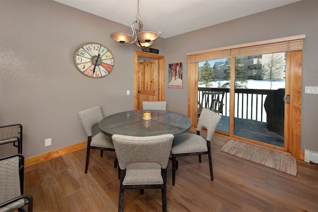 164 Buck Ridge Rd Unit 164, Summit Cove, CO 80435 - dining space featuring a chandelier and wood finished floors