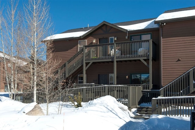 164 Buck Ridge Rd Unit 164, Summit Cove, CO 80435 - snow covered back of property with stairway