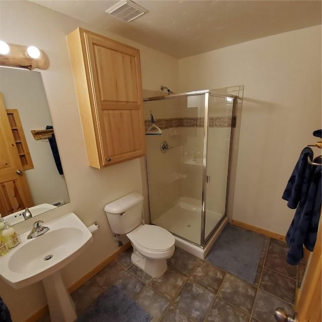 91399 Ryan Gulch Rd Unit B3, Silverthorne, CO 80498 - full bathroom with a stall shower, toilet, baseboards, and a sink
