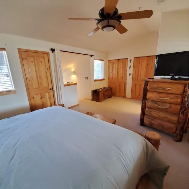 91399 Ryan Gulch Rd Unit B3, Silverthorne, CO 80498 - carpeted bedroom featuring vaulted ceiling, a ceiling fan, and multiple closets