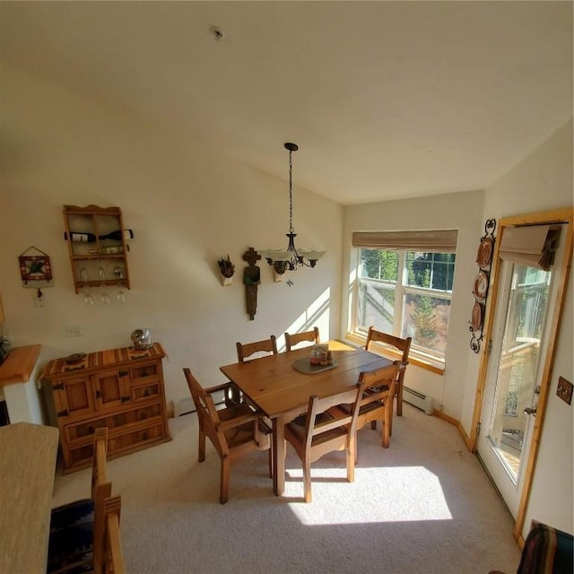 91399 Ryan Gulch Rd Unit B3, Silverthorne, CO 80498 - dining space featuring a chandelier, light carpet, and a baseboard heating unit