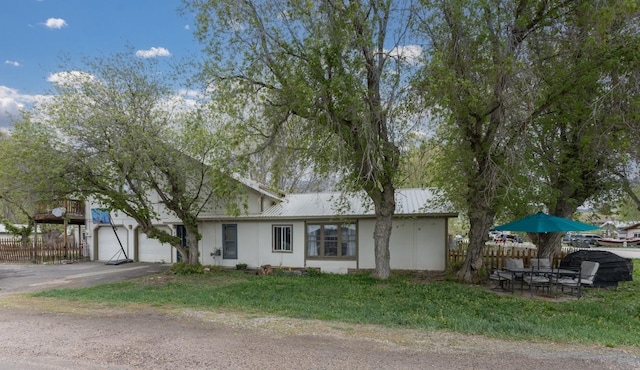 21490 2nd Ave, Milner, CO 80487 - ranch-style home featuring asphalt driveway, a garage, and metal roof