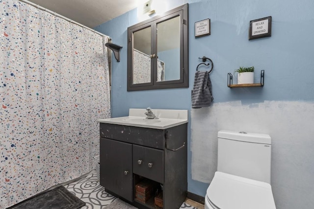 21490 2nd Ave, Milner, CO 80487 - bathroom featuring toilet, vanity, and a shower with shower curtain