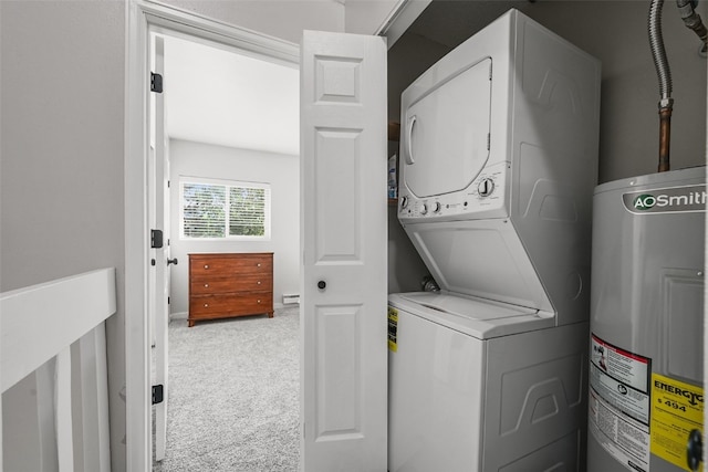 6941 Ryan Gulch Rd Unit 6941, Silverthorne, CO 80498 - washroom featuring stacked washer and clothes dryer, water heater, and carpet flooring