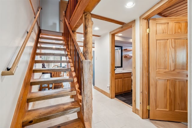 stairway with baseboards and recessed lighting