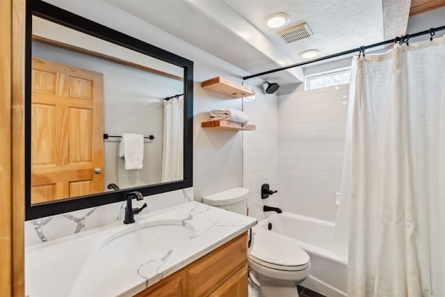 full bathroom featuring shower / tub combo, vanity, toilet, and visible vents