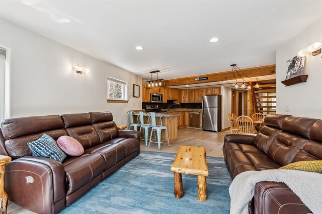 living room with recessed lighting and light wood finished floors
