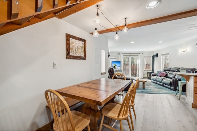 dining area with recessed lighting and light wood finished floors